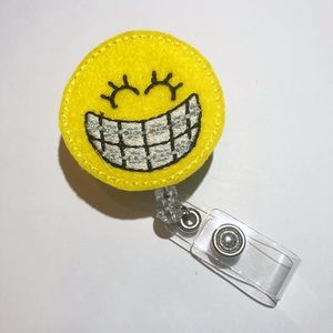 Orthodontist Smiley Face w/Braces Felt Badge Reel